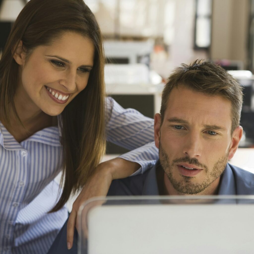 Business people in office using computer