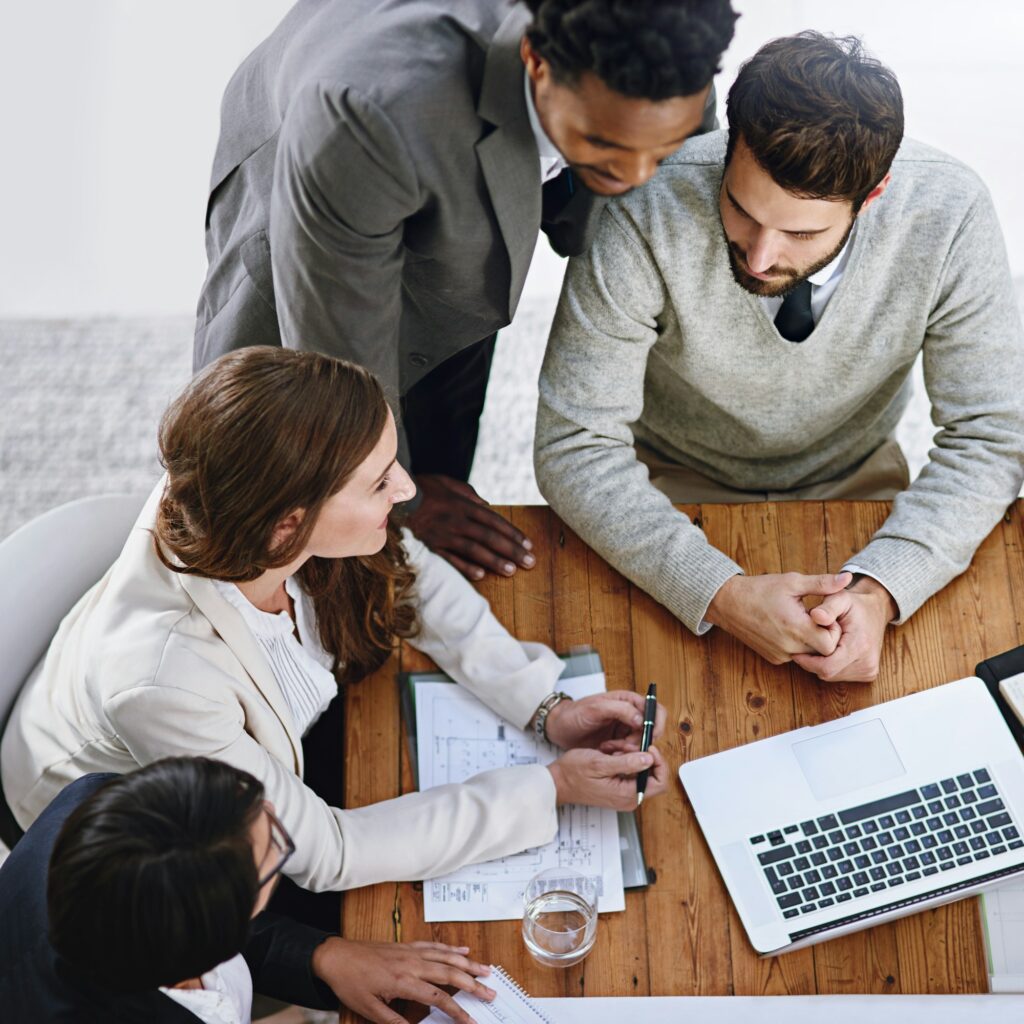 High angle shot of a group of businesspeople having a meeting in an office